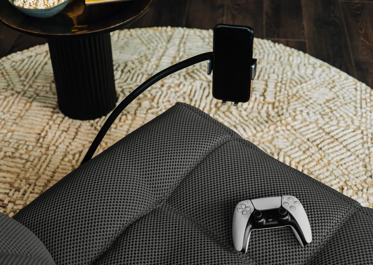 A power gliding game chair in grey from EZ Livings Java range. Closeup of phone holder
