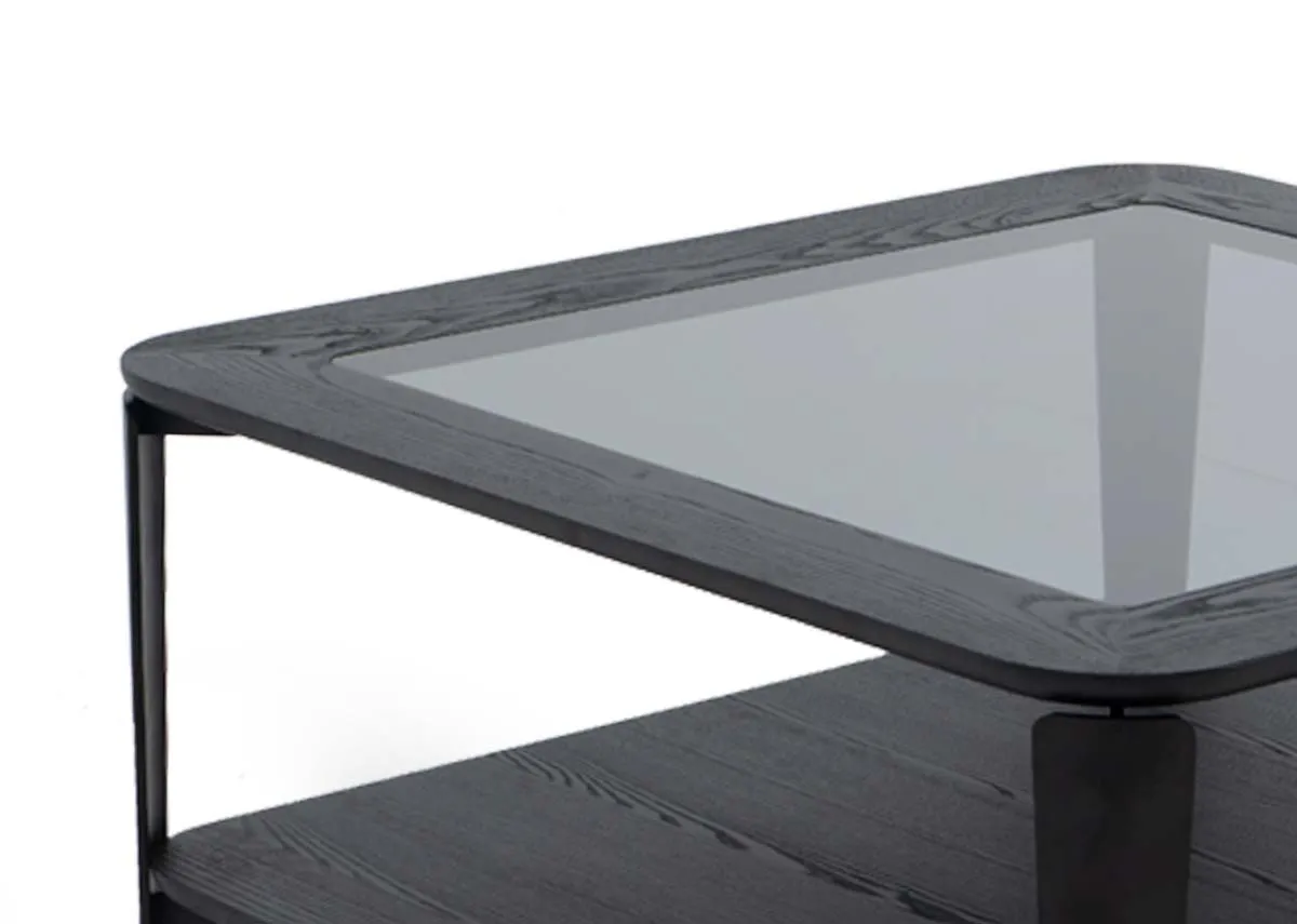 A square coffee table with glass top from EZ Livings Lana range. Closeup of black frame.