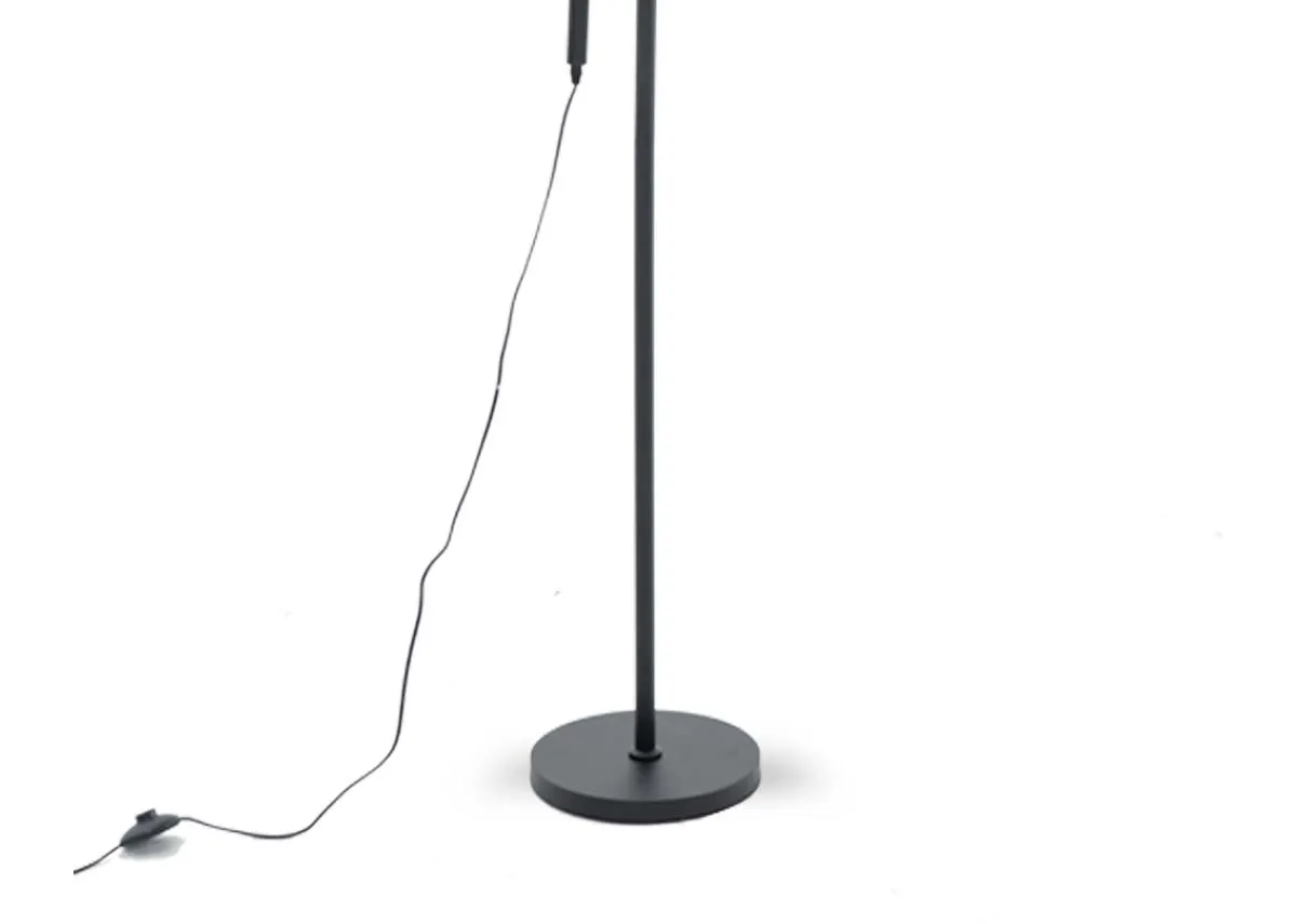 A black floor lamp from EZ Livings Casper range. Closeup of round base