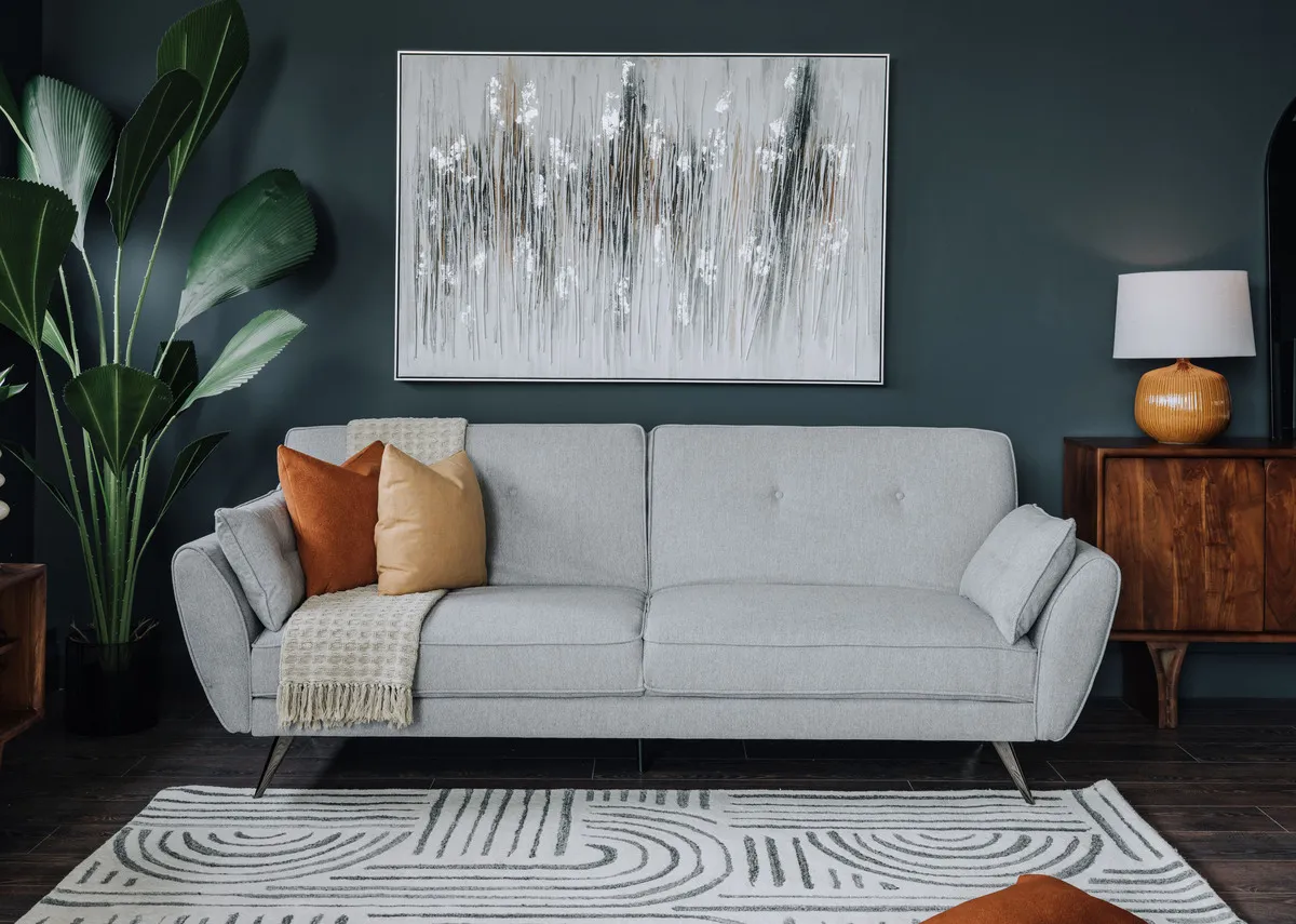 A lifestyle image of the Faye Soft cushion with Chloe sofabed.