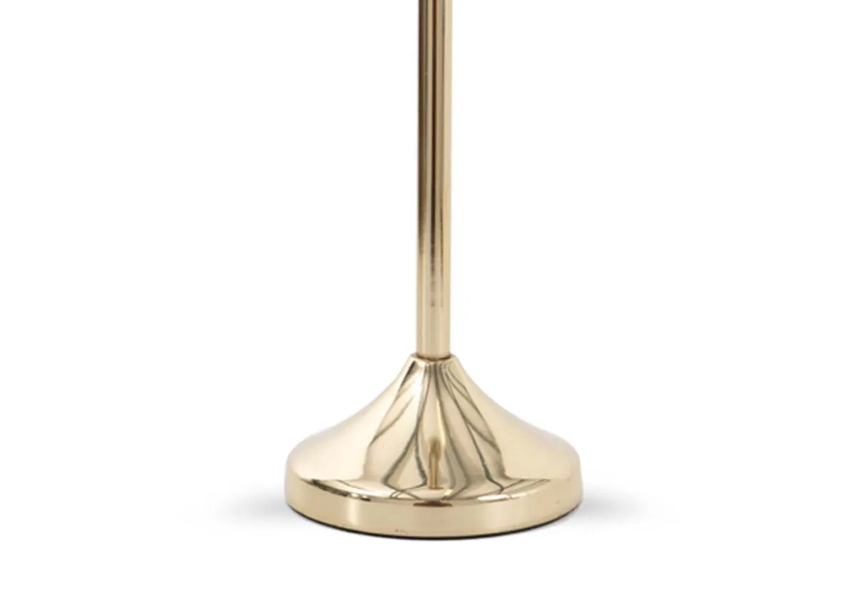 A gold single candle holder from EZ Livings Joy range. Closeup of disc base.