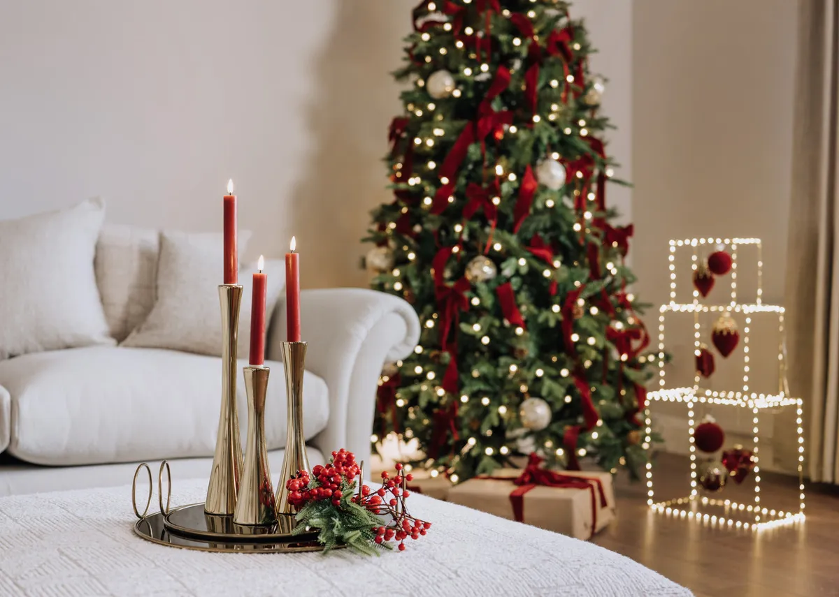 A lifestyle image of the Gold Single stock candleholders on a round mirror tray with Ember pick.