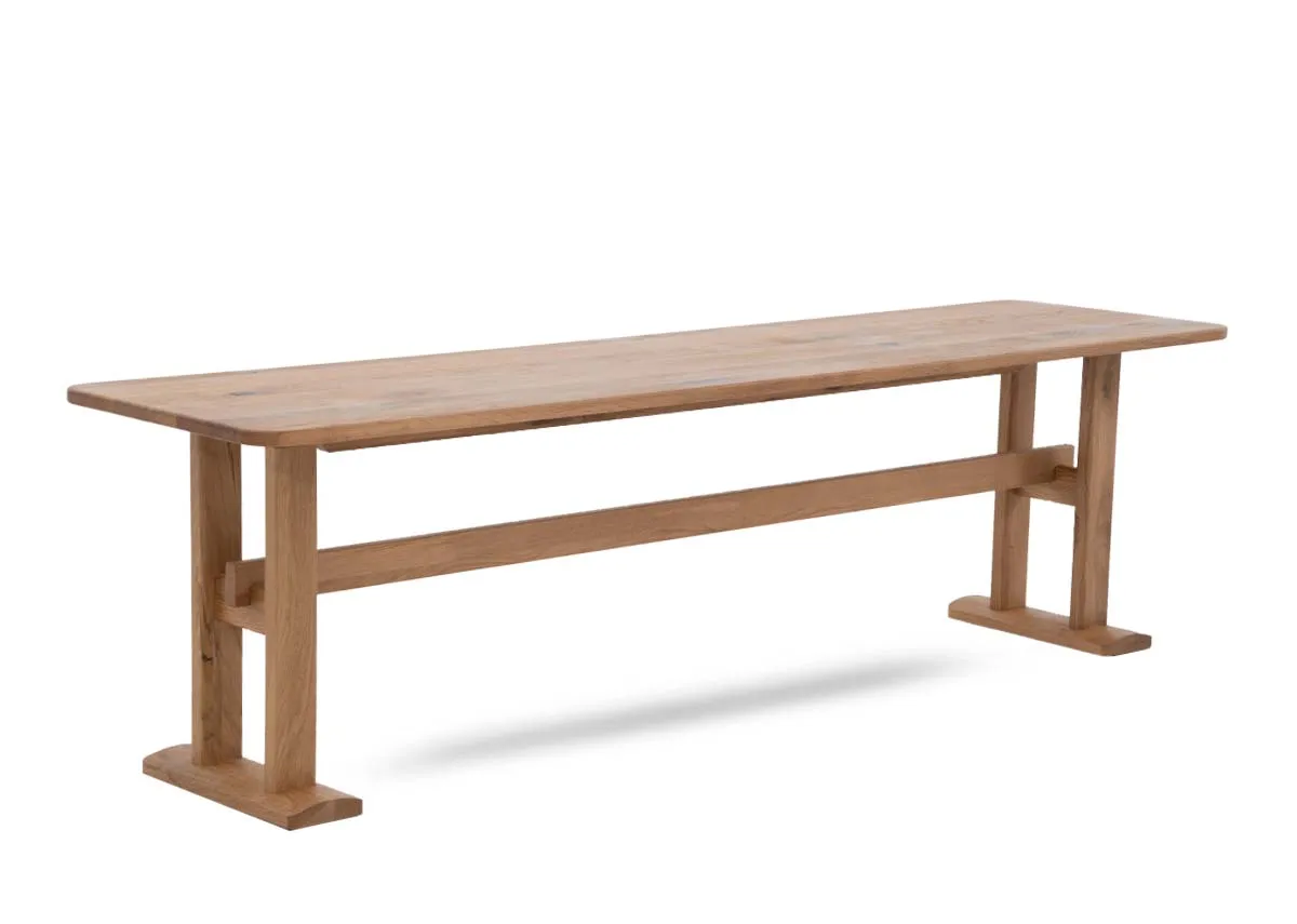 A rectangular oak bench from EZ Livings Hudson range. Angled view of supportive legs.
