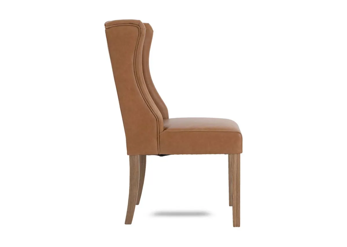 A tan leather dining carver chair from EZ Livings Naxos range. Side view of curved edges