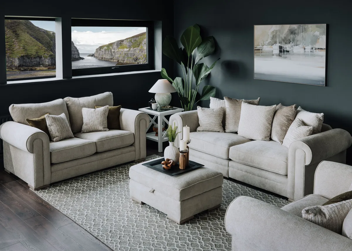 A lifetsyle image of the Olivia sofas with the Heiny rug and Marina picture.