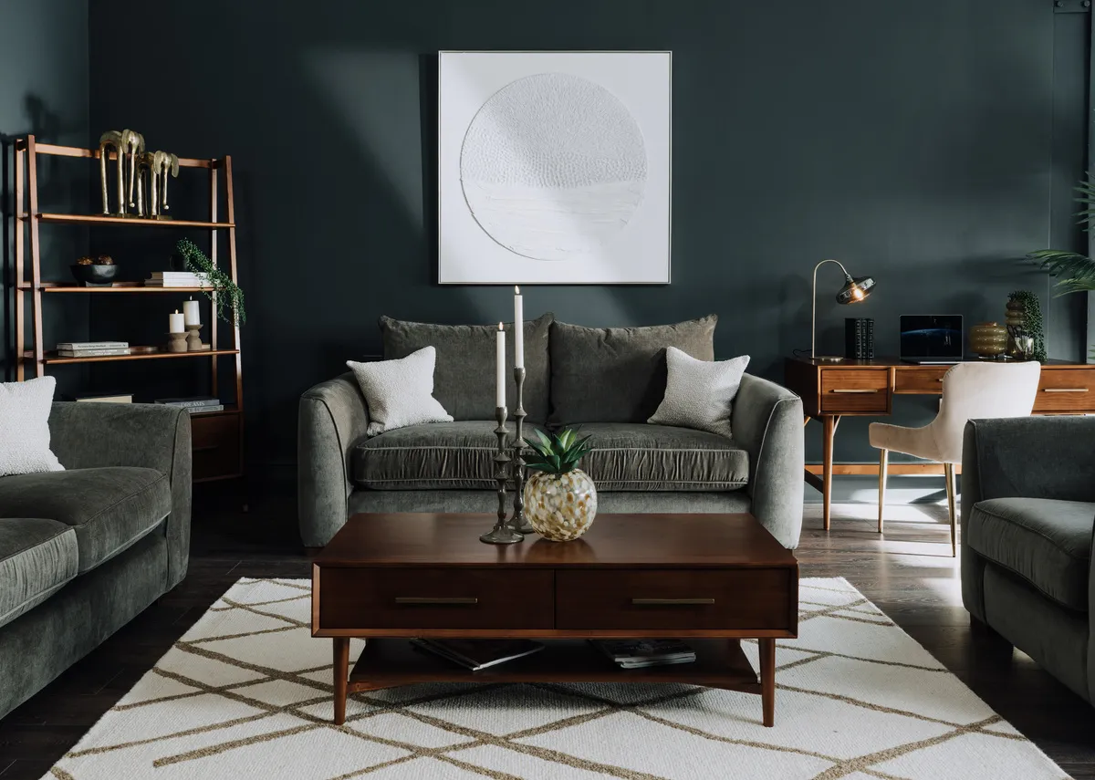 A lifestyle image of the Monterose rug with Leya coffee and lamp table with Lucius green sofa range.