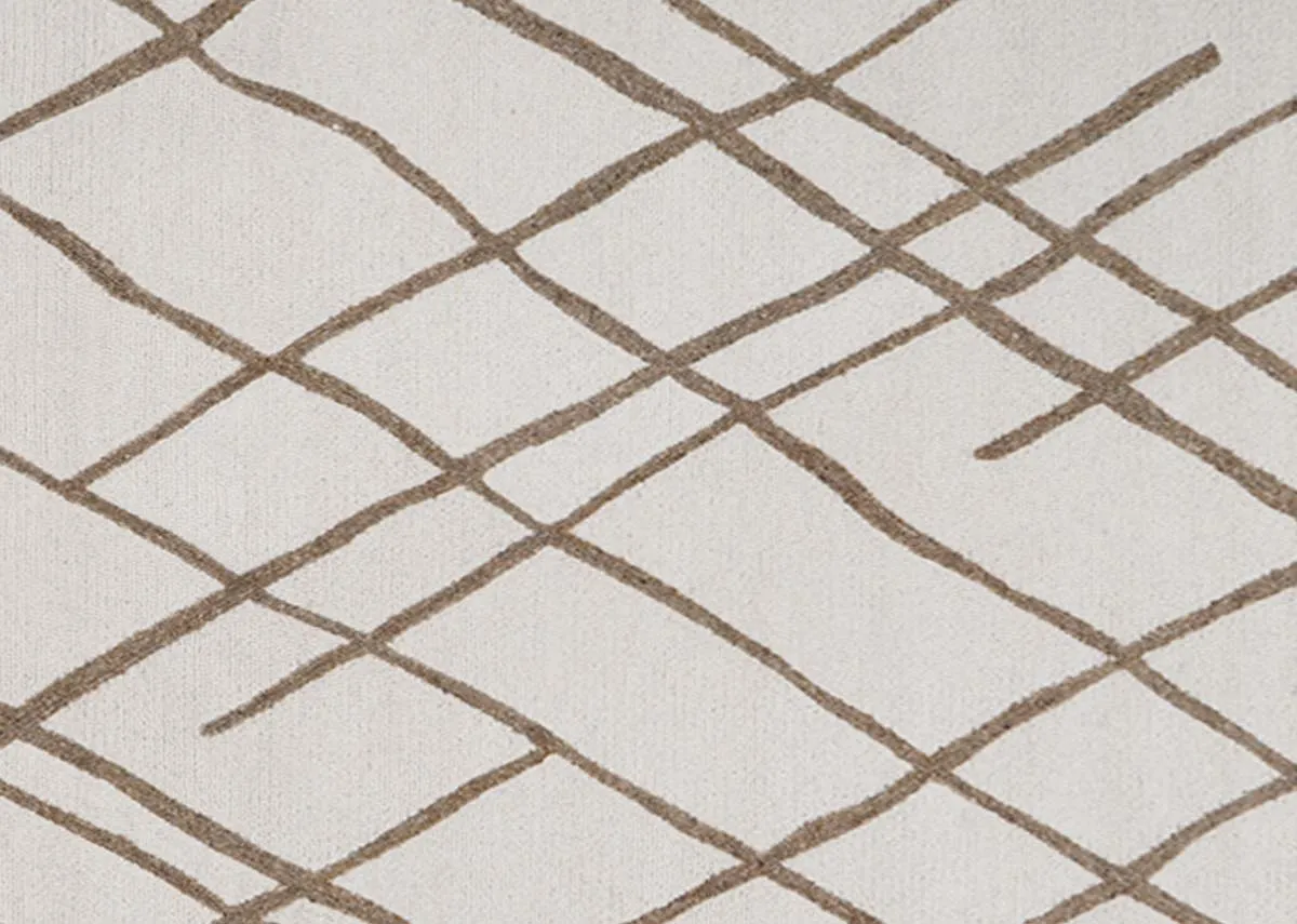A cream rug with gold slashes from EZ Livings Monterose range.Closeup of gold strike detail.