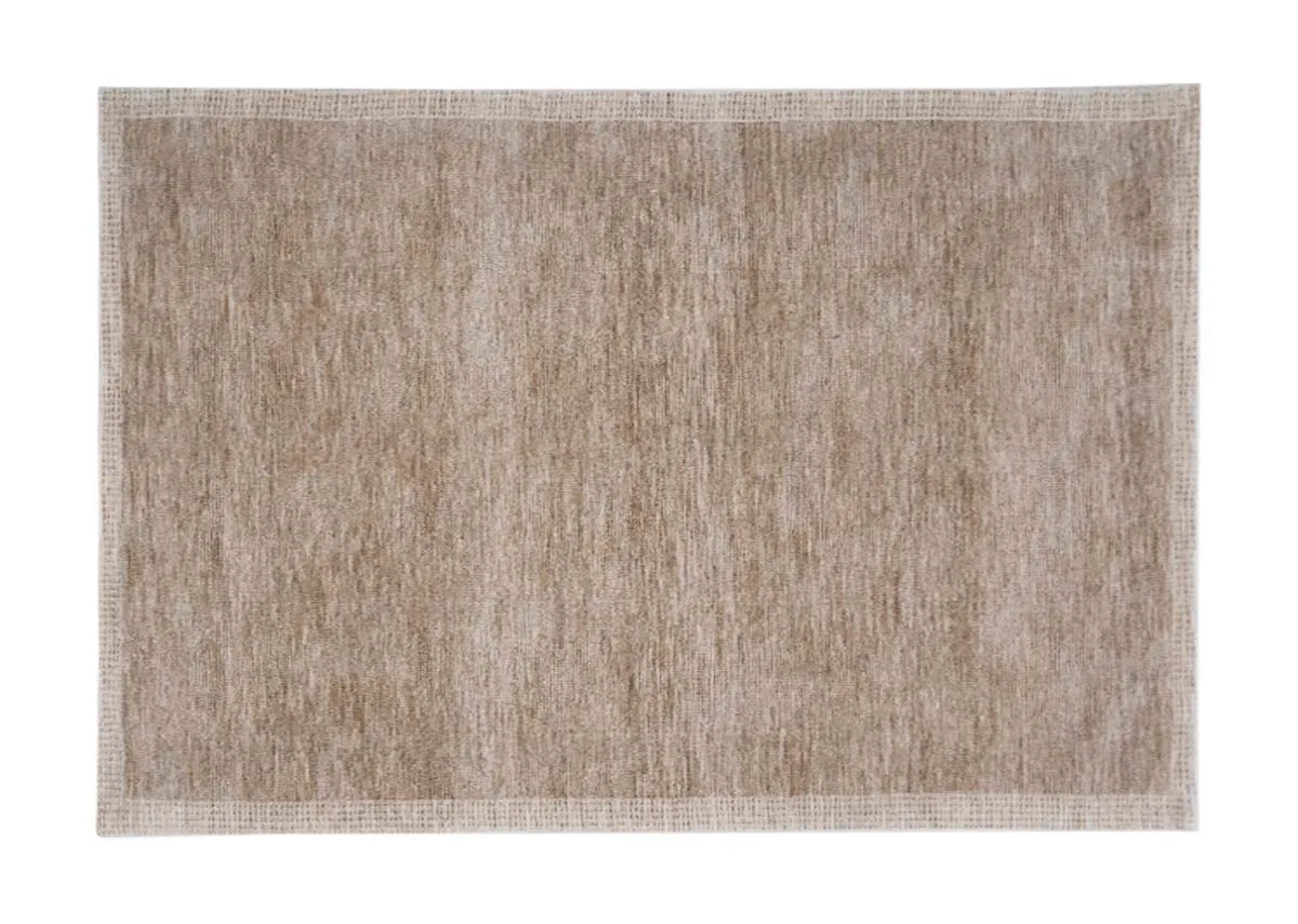 A rectangular rug in a light sandy beige colour displaying a uniform textured surface with a subtle border.