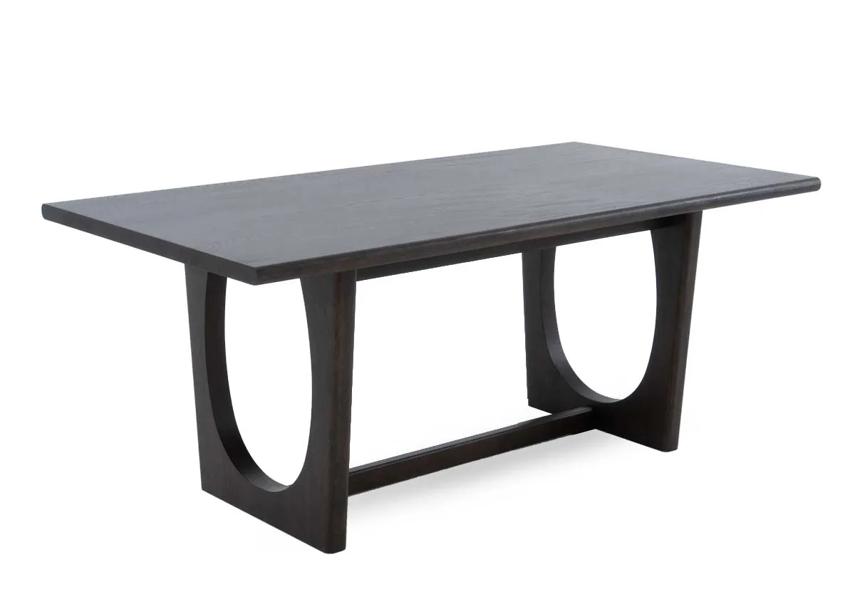 A dark brown oak dining table from EZ Livings Flow range. Angled view of table without extension.