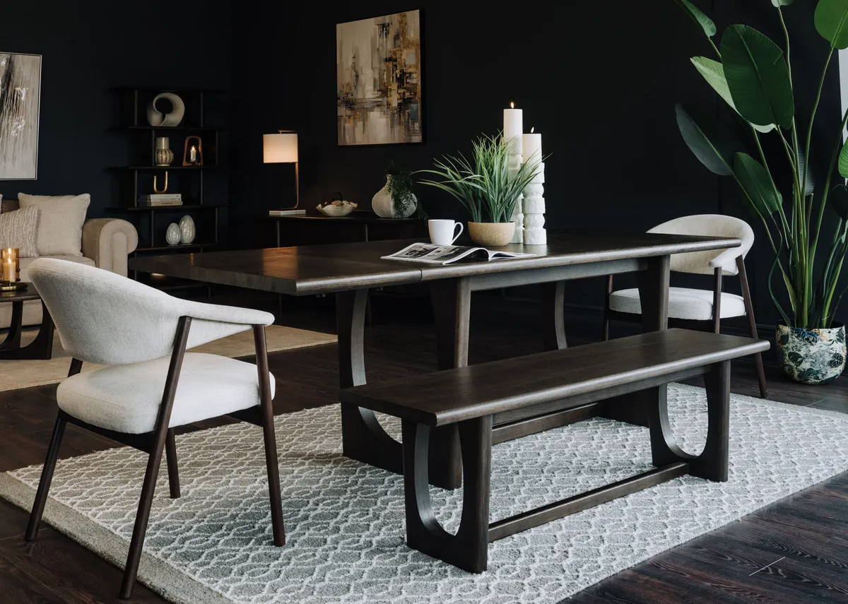 A lifetsyle image of the Flow dining table extended with bench & Elk chairs