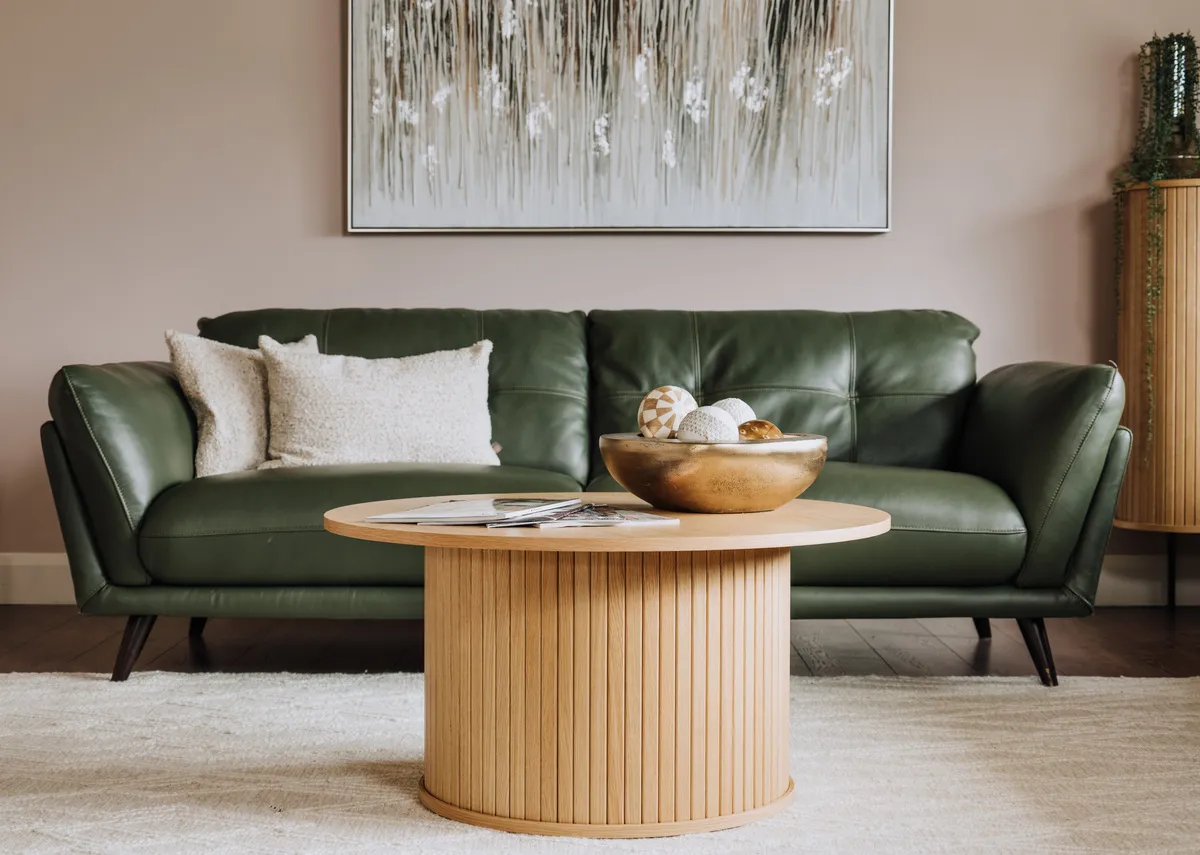 A lifestyle image of the Nola coffee table with toscana sofa and Tones of Grey canvas.