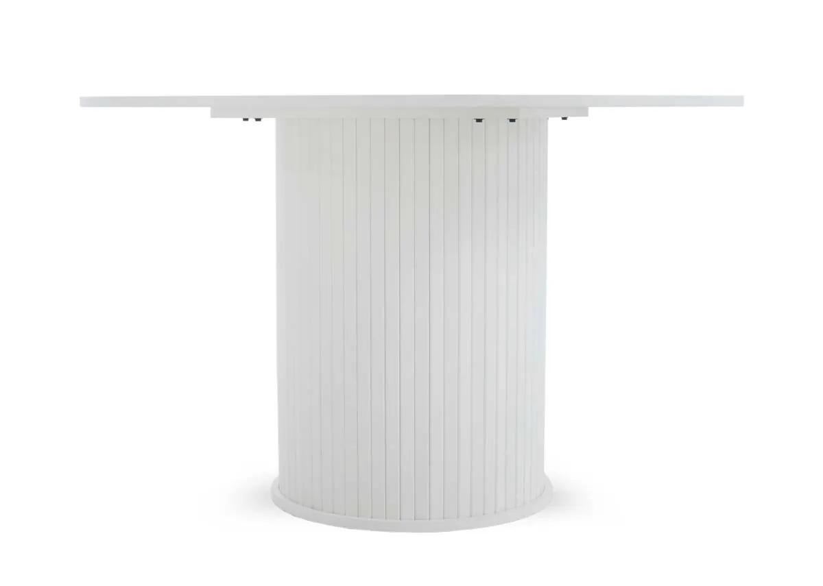 A straight side view of the white round dining table highlighting the circular top and the cylindrical fluted base.