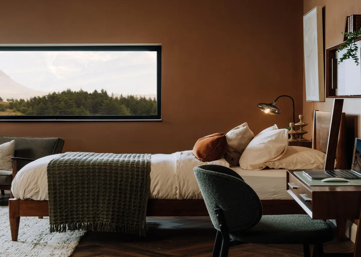 A lifestyle image of the Leya bedframe side view withdesk