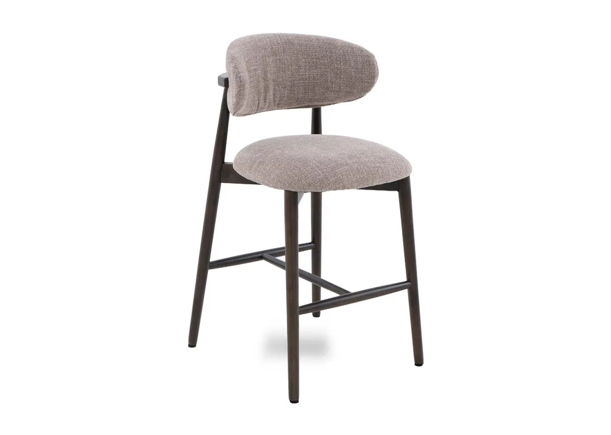 A beige fabric counter bar stool with drown wood frame from EZ Livings Hazel range. Angled view.