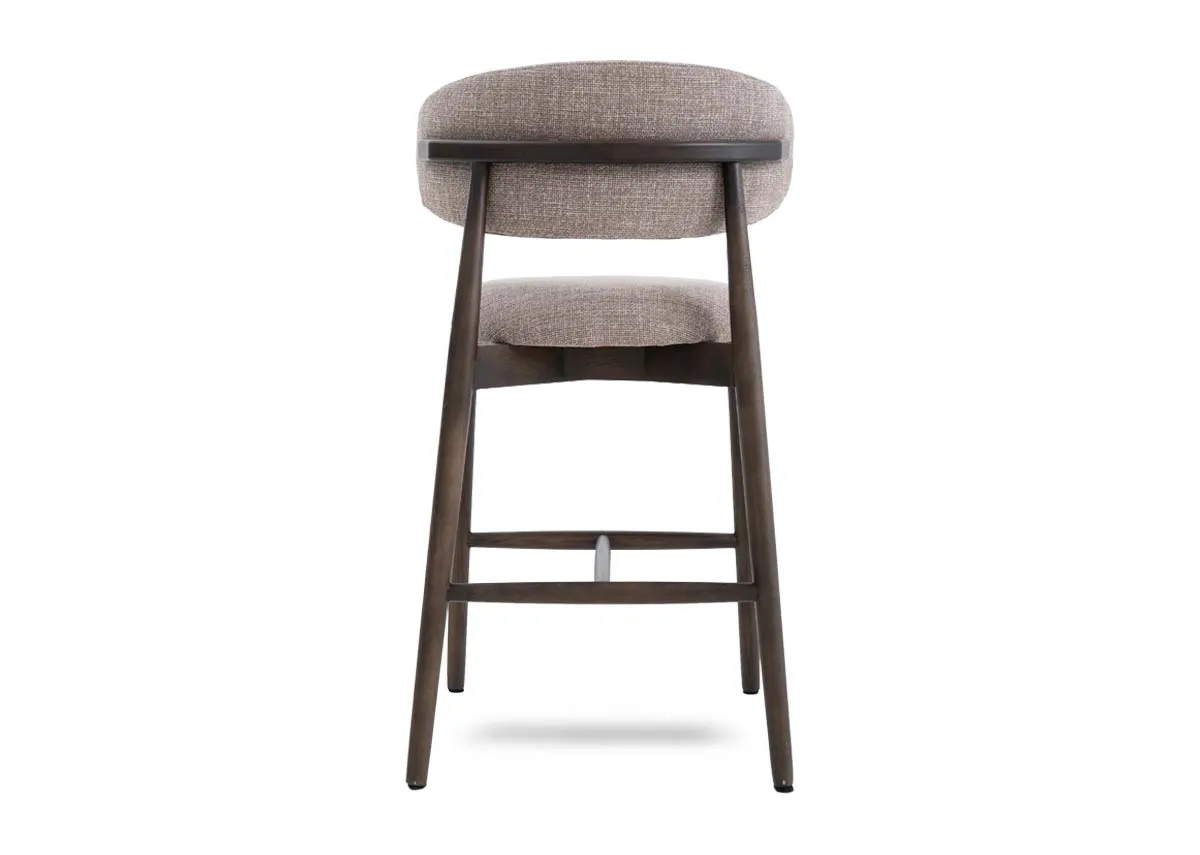 A beige fabric counter bar stool with drown wood frame from EZ Livings Hazel range. Back view