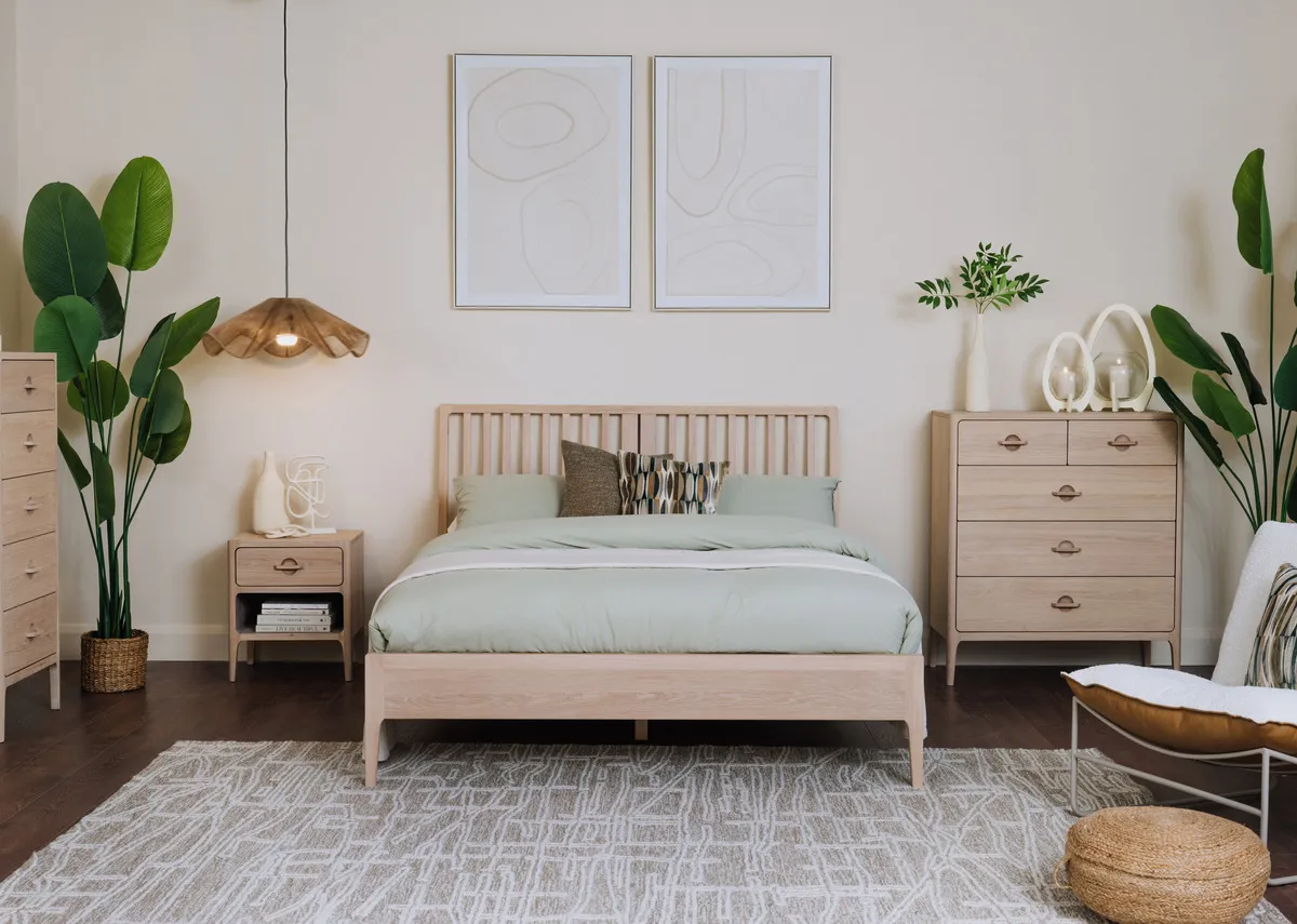 A lifetsyle image of the Jay bedframe with chest and locker with Gateway canvas pics.
