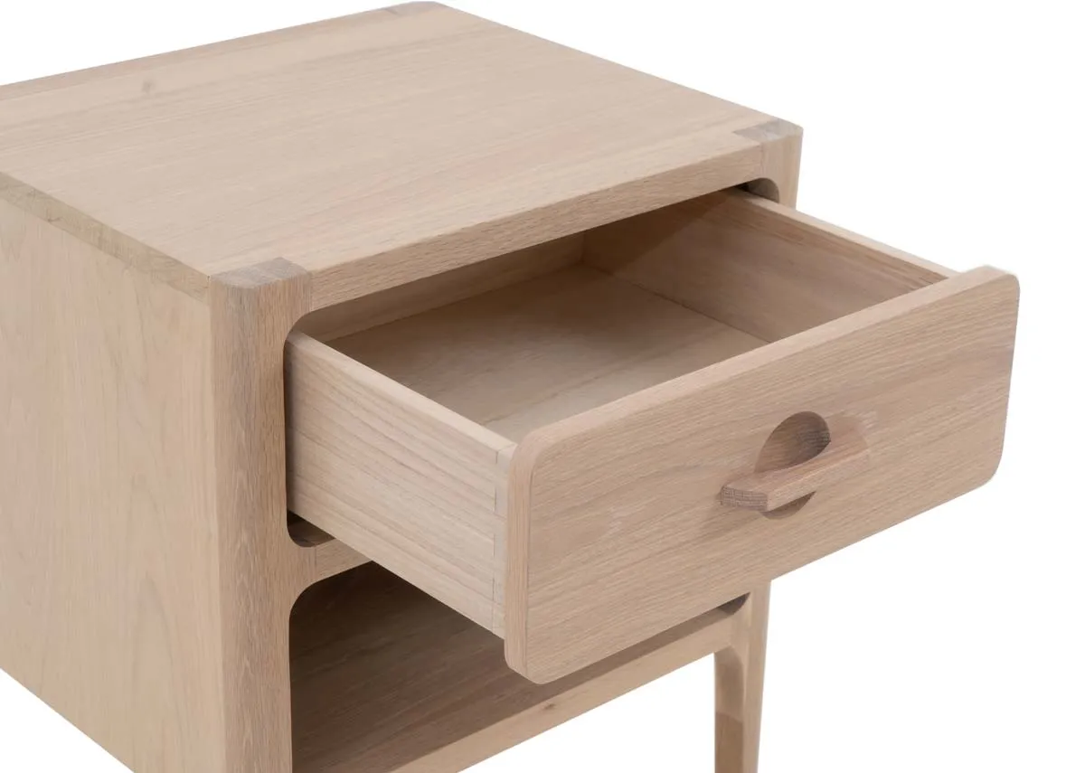 A white oak locker with a drawer and lower shelf from EZ Livings Jay range.Closeup of open drawer