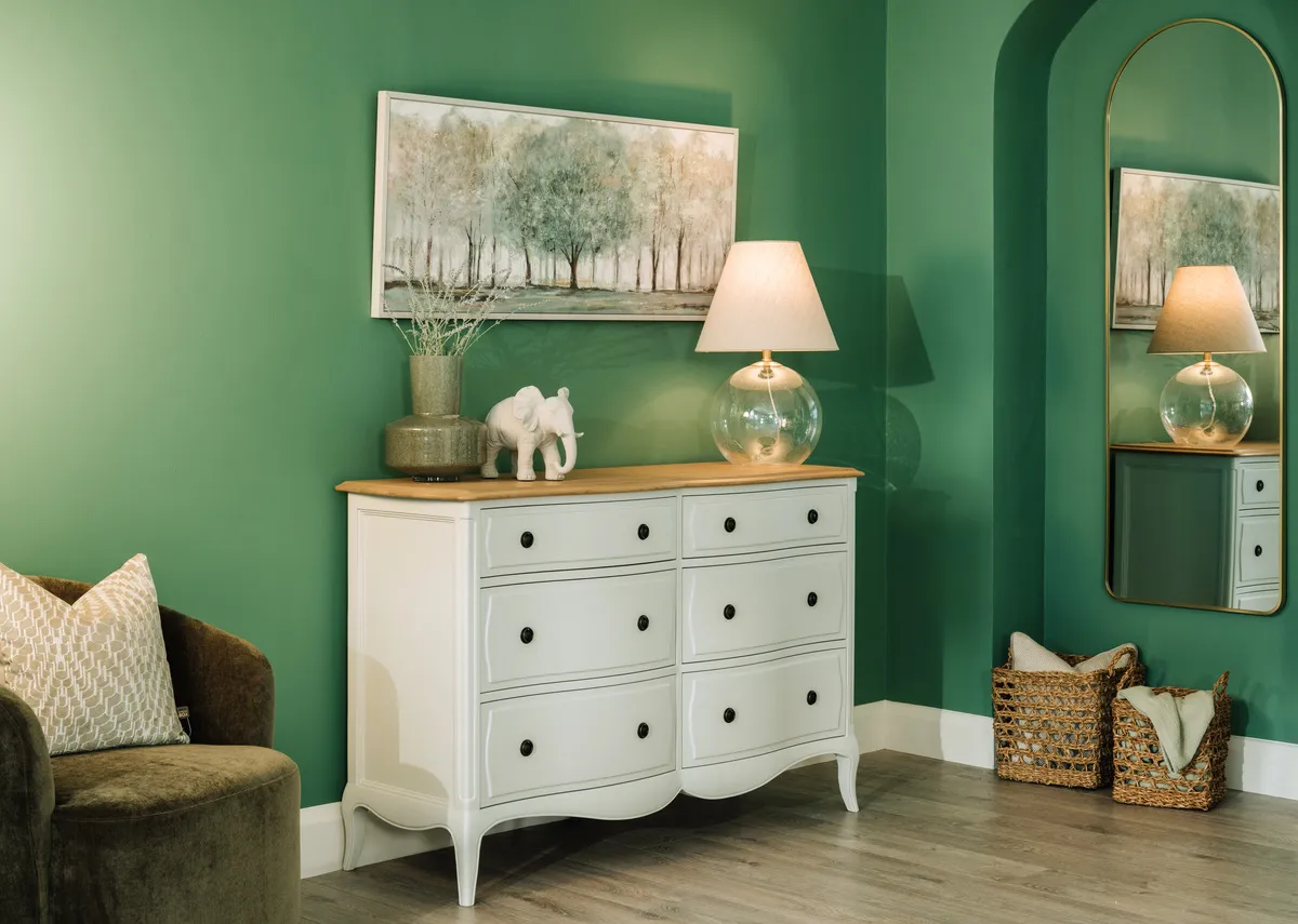 A lifestyle image of the Amelie dresser with Daydream canvas and 2 Sandy baskets under the Vance mirror.