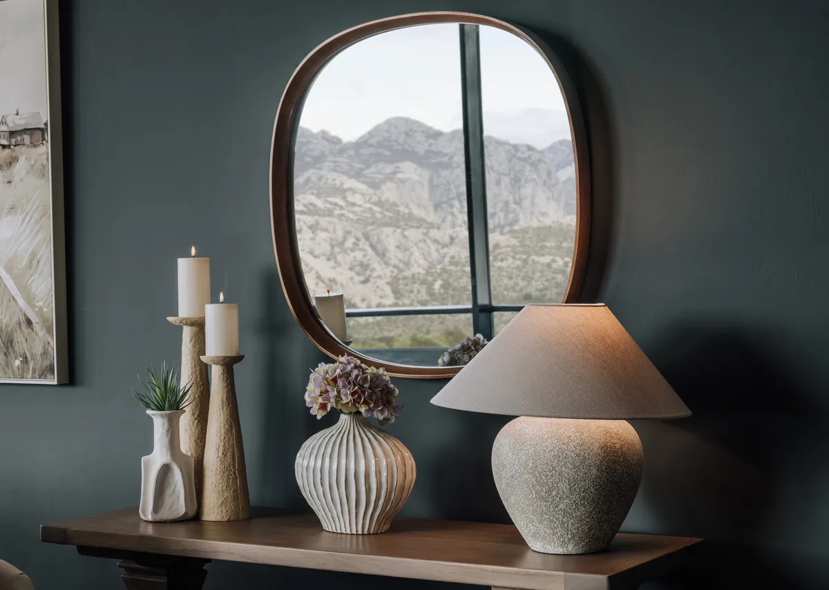 An off white bulb shaped vase from EZ Livings Lorito range.Closeup of gloss painted finish