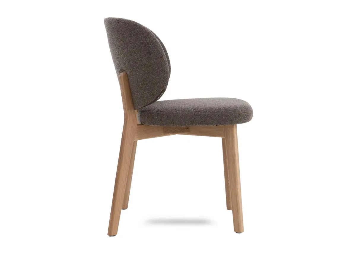 A taupe brown dining chair from EZ Livings Swan range. Side view of curved backrest.