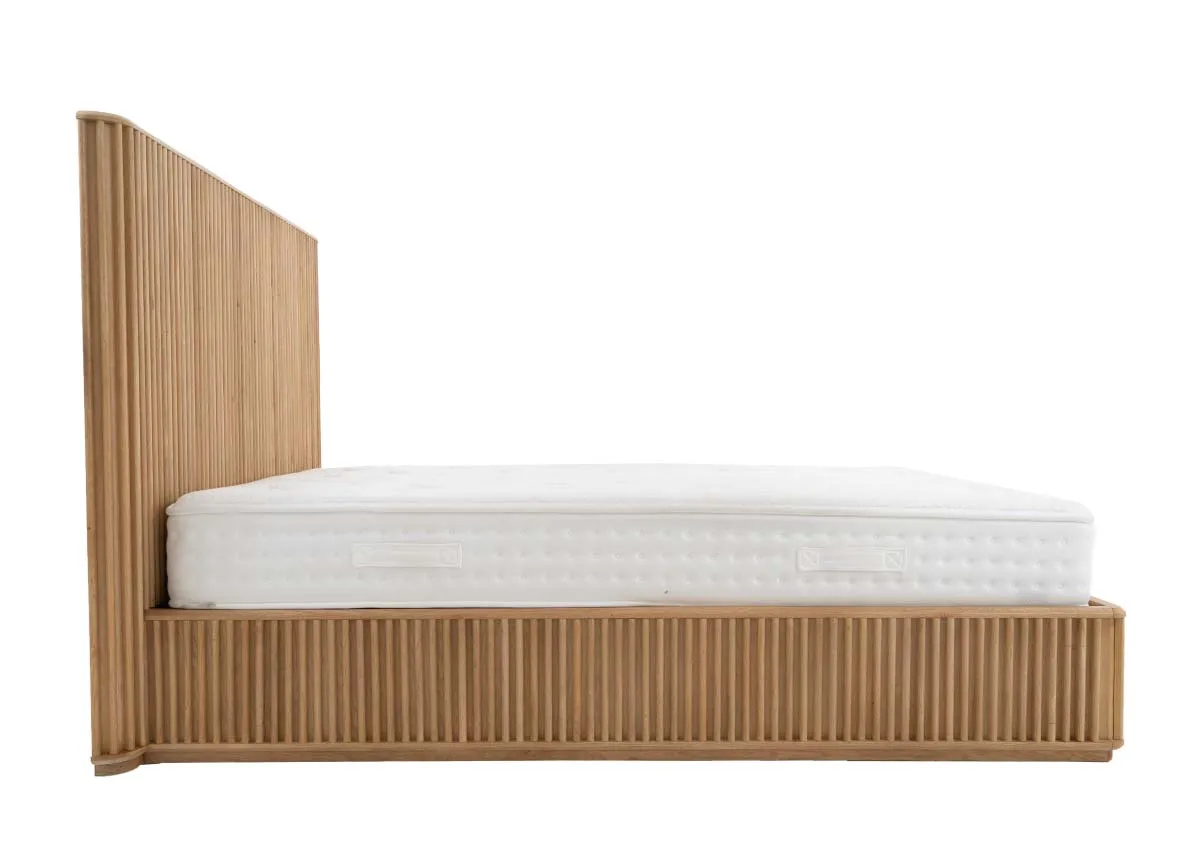 A natural oak bedframe with slatted base and headboard from EZ Livings Bradley range.Side view