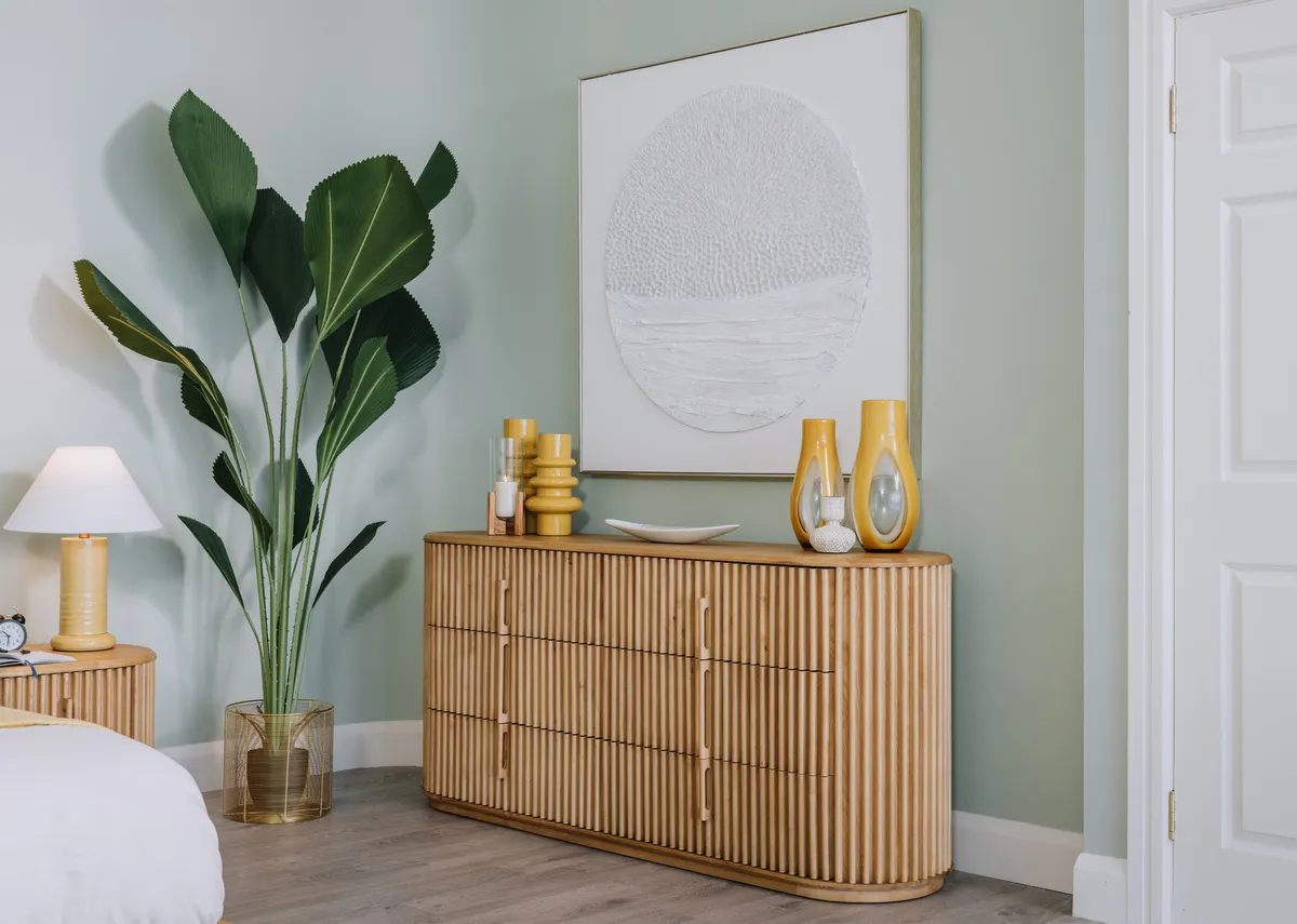 A lifetsyle image of the bradley dresser with Pathways canvas.