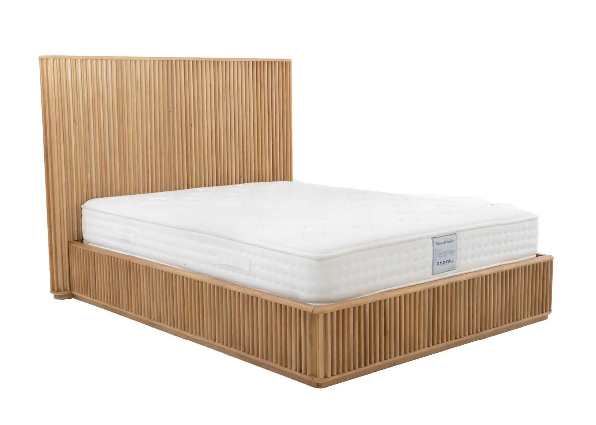 A natural oak bedframe with slatted base and headboard from EZ Livings Bradley range. Angled view