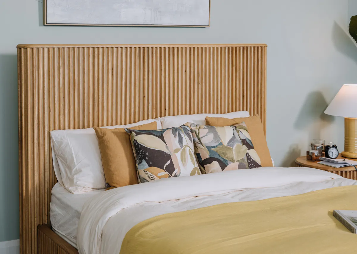 A dimension image of the Bradley bedframe with 209cm x 216cm x 135cm