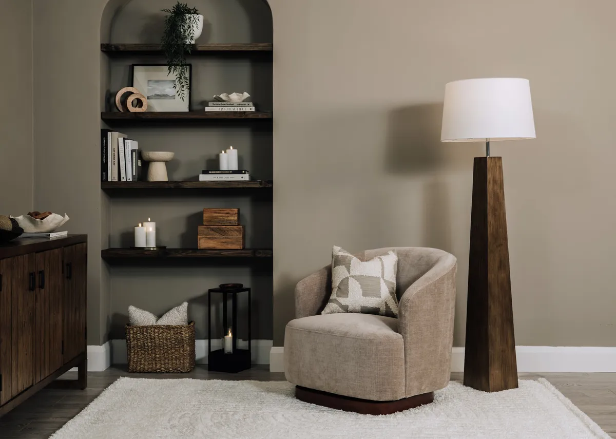 A lifetsyle image of the Briony rug with Danica swivel and Fauna lamp