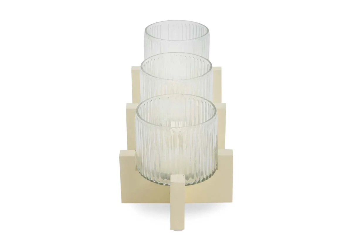 A cream stand with 3 ribbed glass candle holders from EZ Livings Piper range. Side view