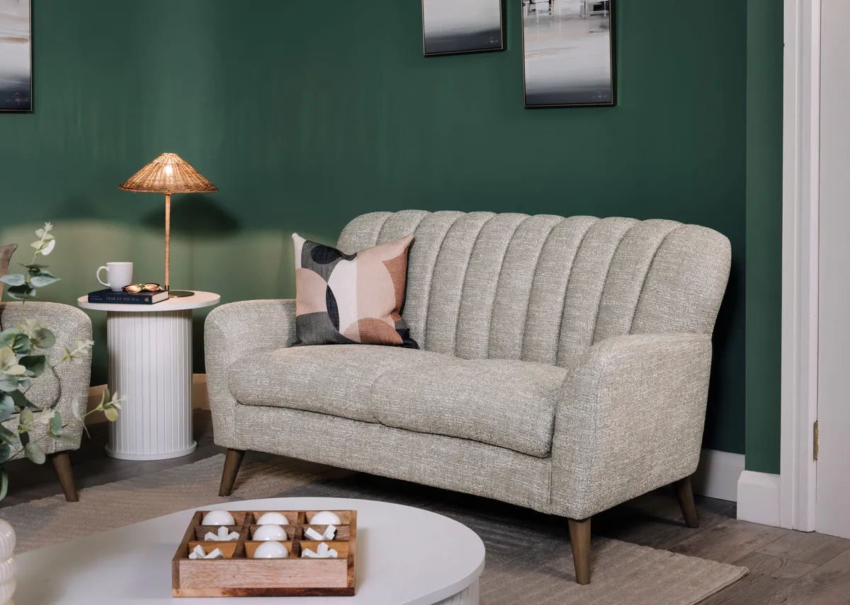 A harper 2 seater sofa with the Glenveagh lamp on the Nola white side table.