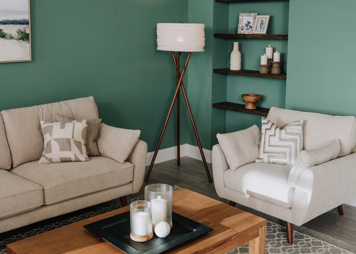 A lifestyle image of the Coolrain floor lamp with Caoimhe natural sofas.
