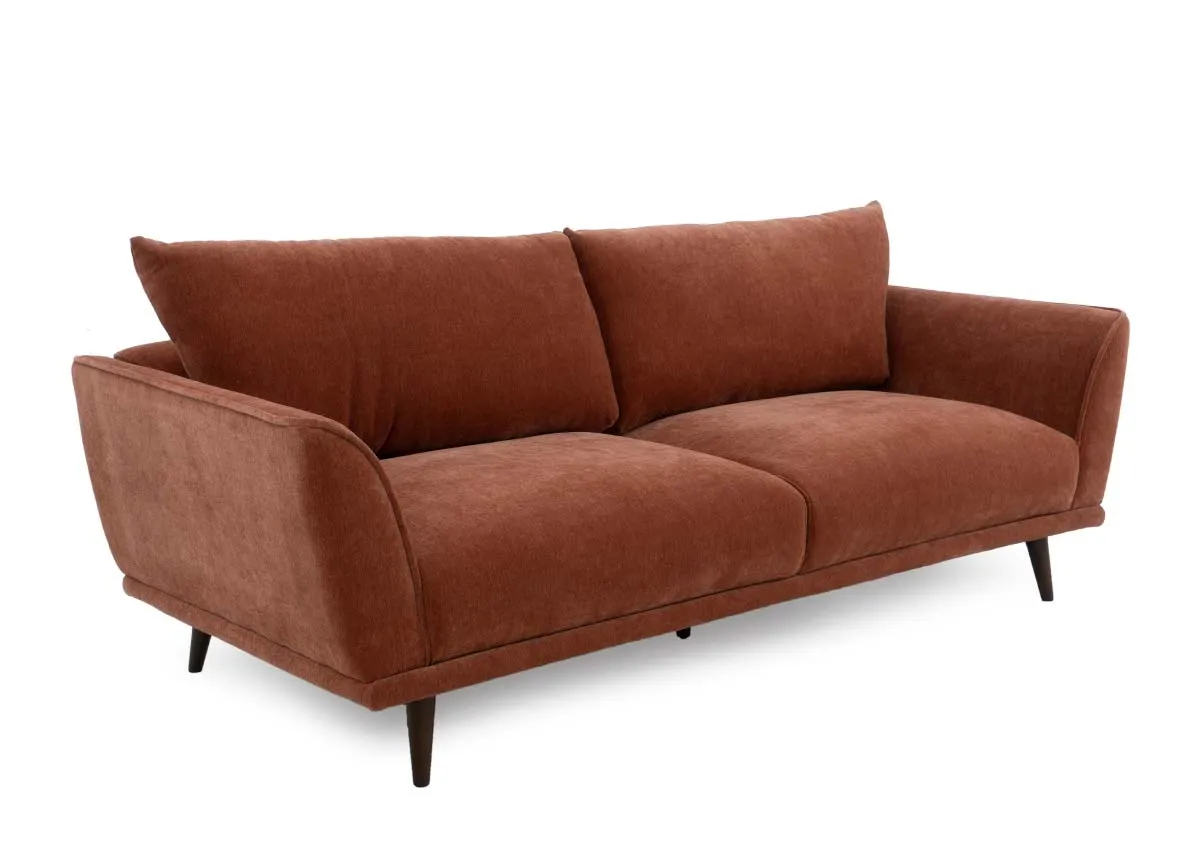 A rust fabric 3 seater sofa from EZ Livings Boutique range. Angled veiw of wide pillow back and retro style.