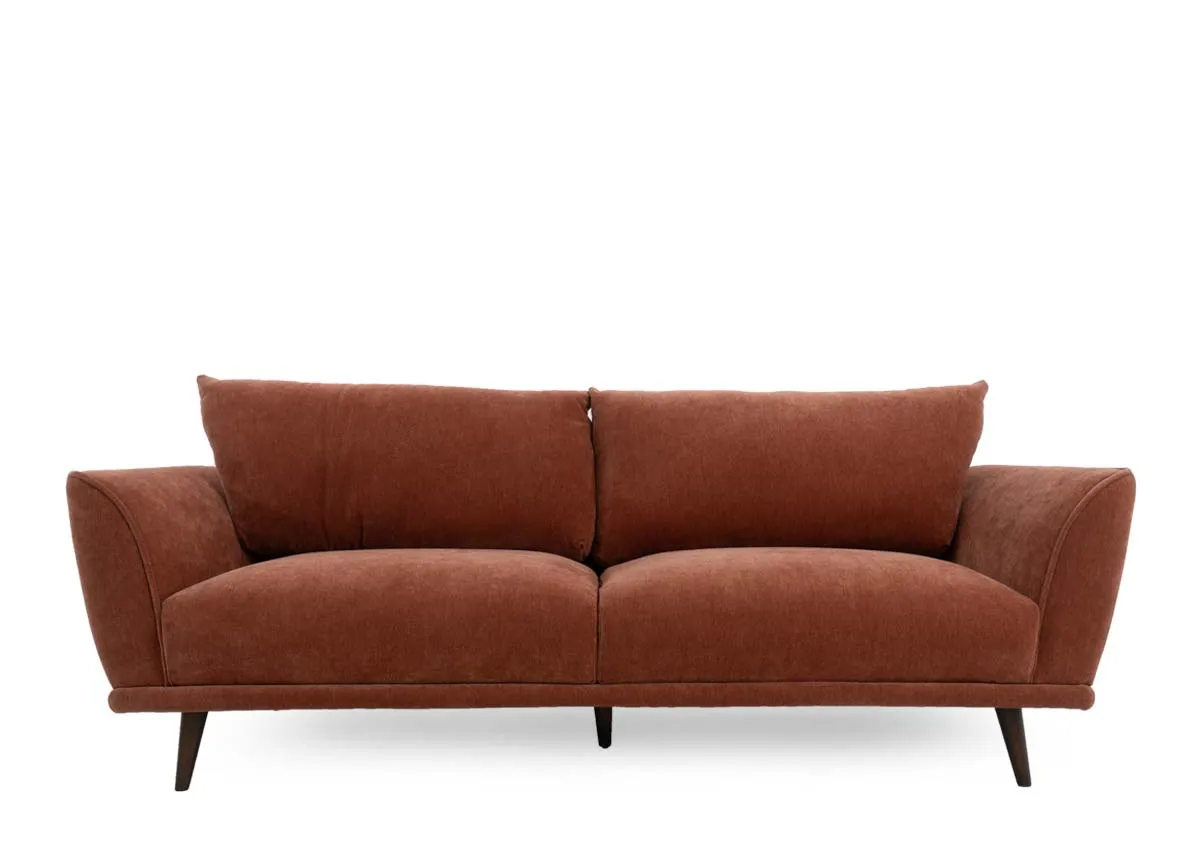 A rust fabric 3 seater sofa from EZ Livings Boutique range. Front view of padded seat cushions.