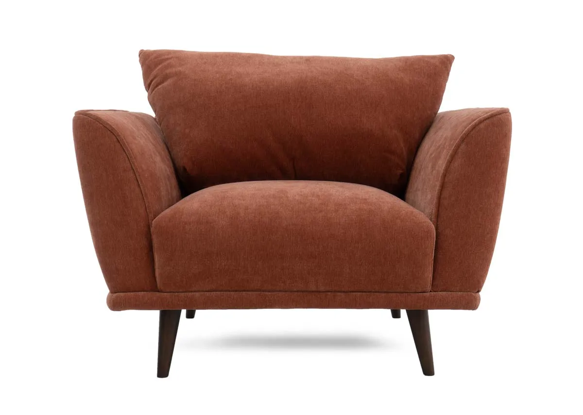 Closeup view of the rounded corner and fabric texture of the silver gray large footstool.