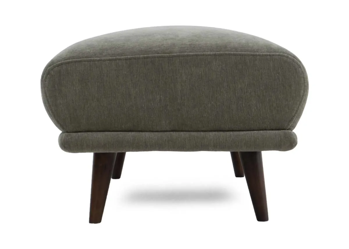 Large footstool in olive green fabric showing the rear view with its rounded edges.