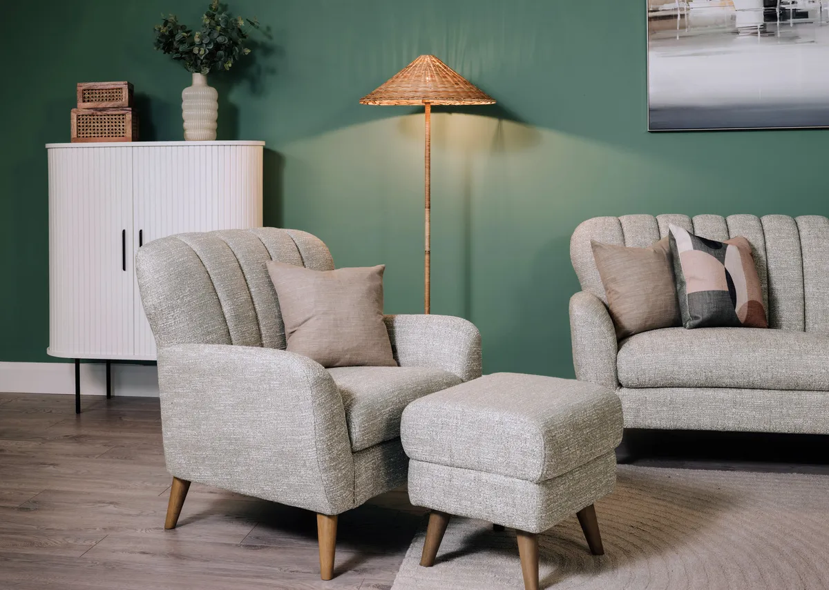 A lifestyle image of the Harper armchari and footstool in light green with nola cabinet and Marina mooring canvas. 