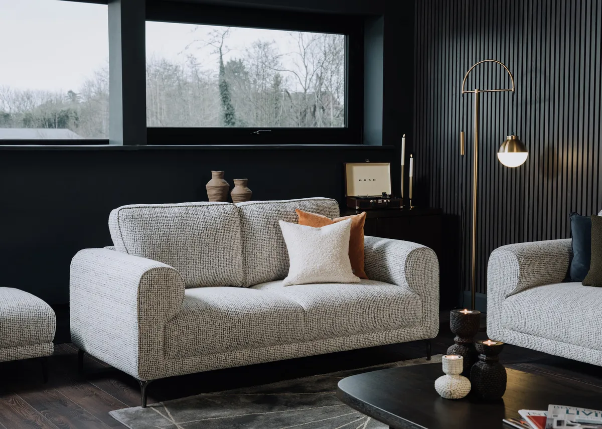 A lifestyle image of the Oyster 2 seater sofa with casper lamp and avery rug.