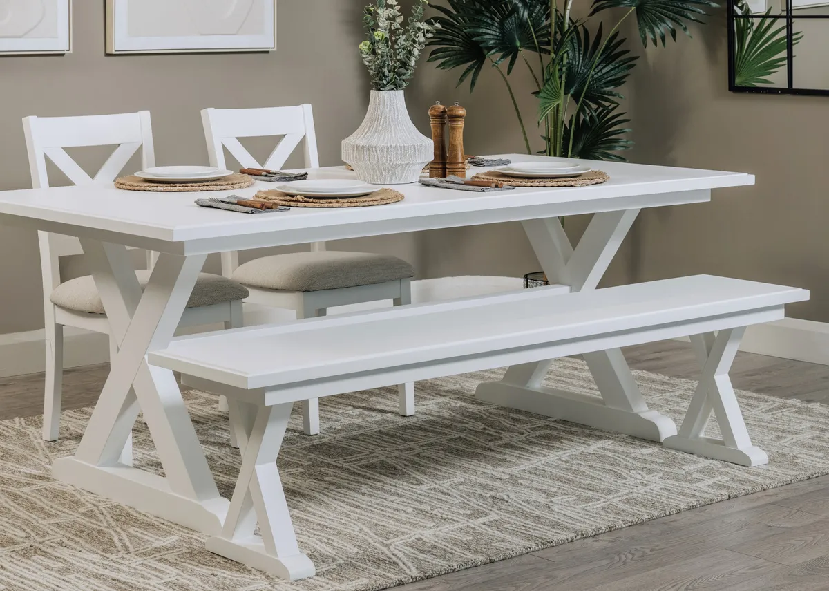 A lifestyle image of the Hampton bench with dining table and Memphis rug.