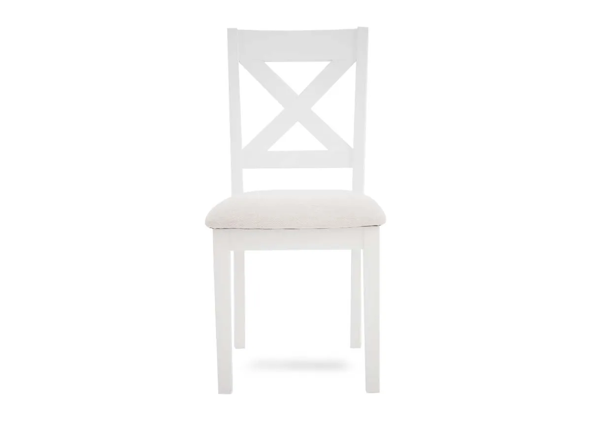 A white x back dining chair from EZ Livings Hampton range. Front view