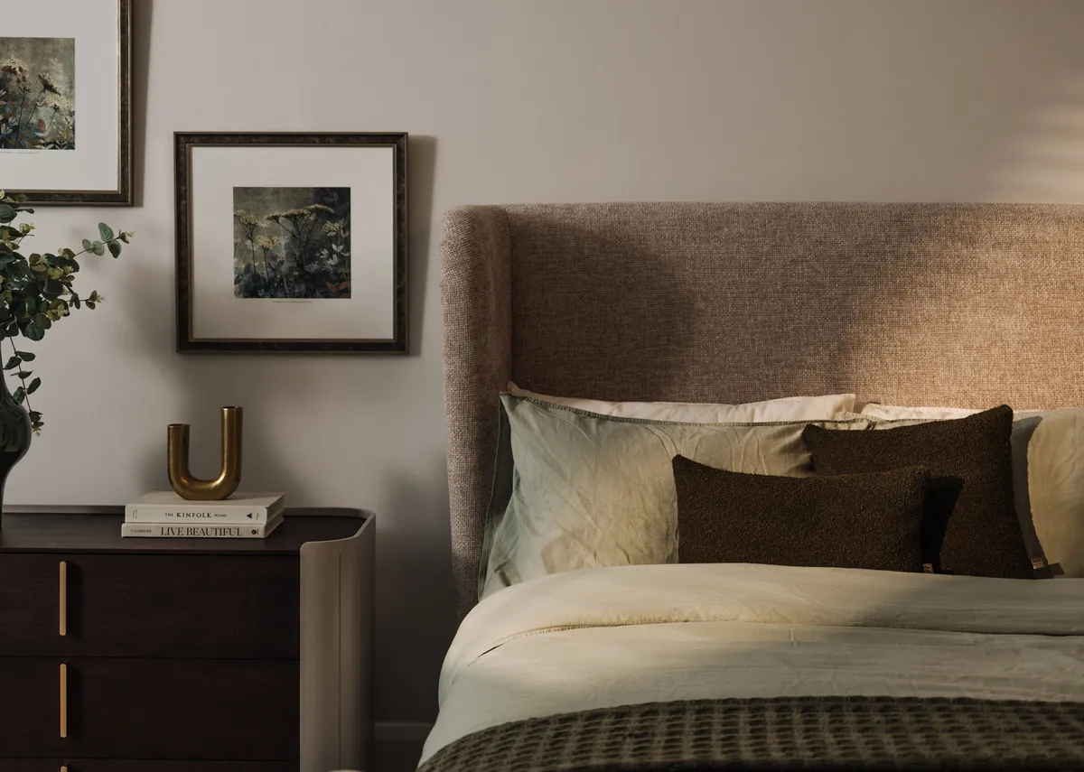 A lifestyle image closeup of the Maison bedframe Benbulbin cushions.