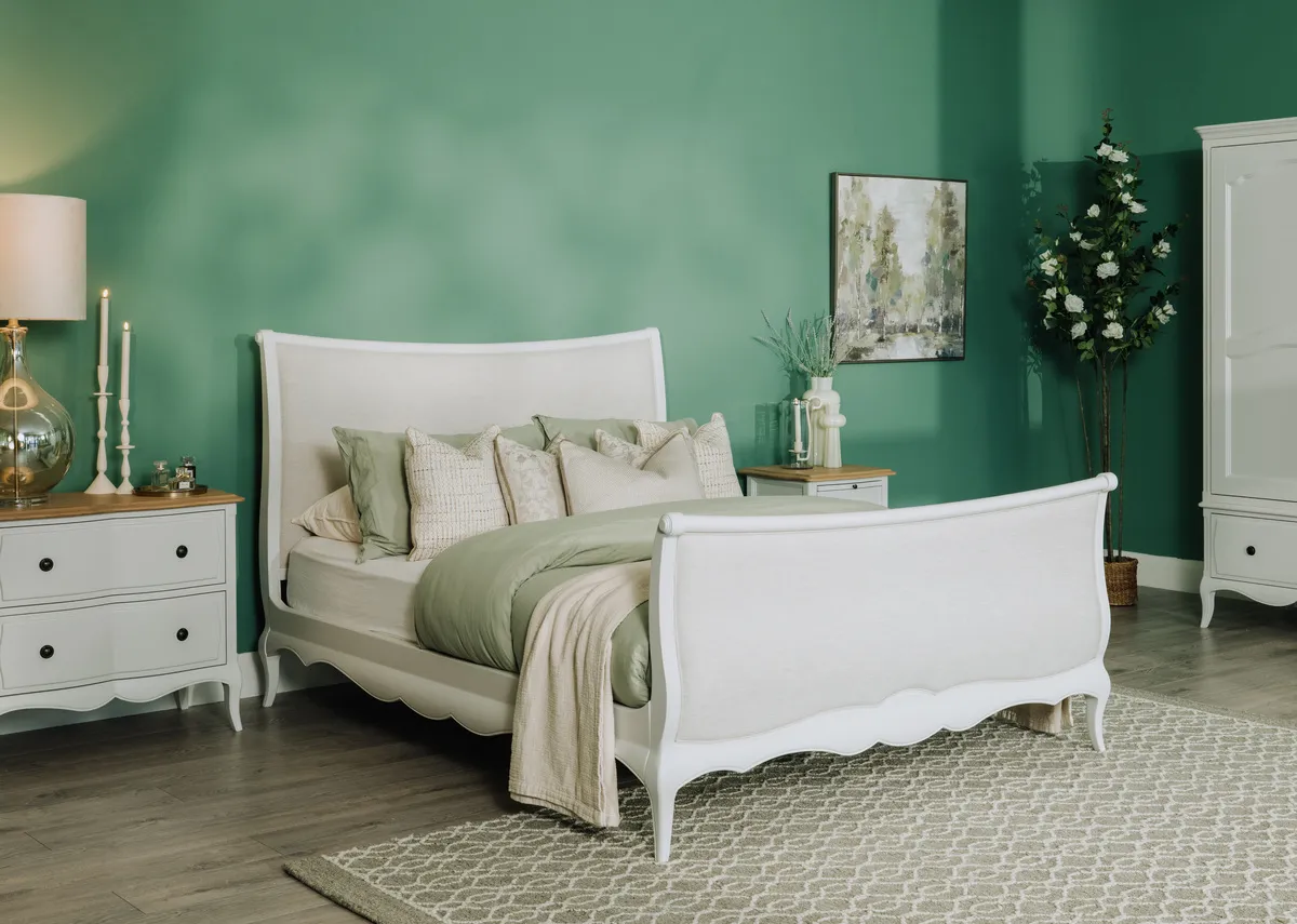 A lifestyle image of the Amelie bedframe with locker and wardrobe with heiny rug