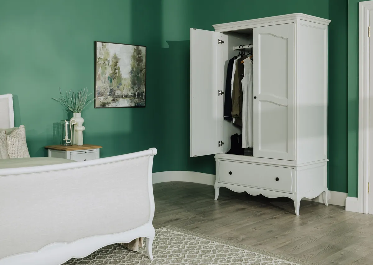 A lifestyle image of the Amelie wardrobe with doors open.