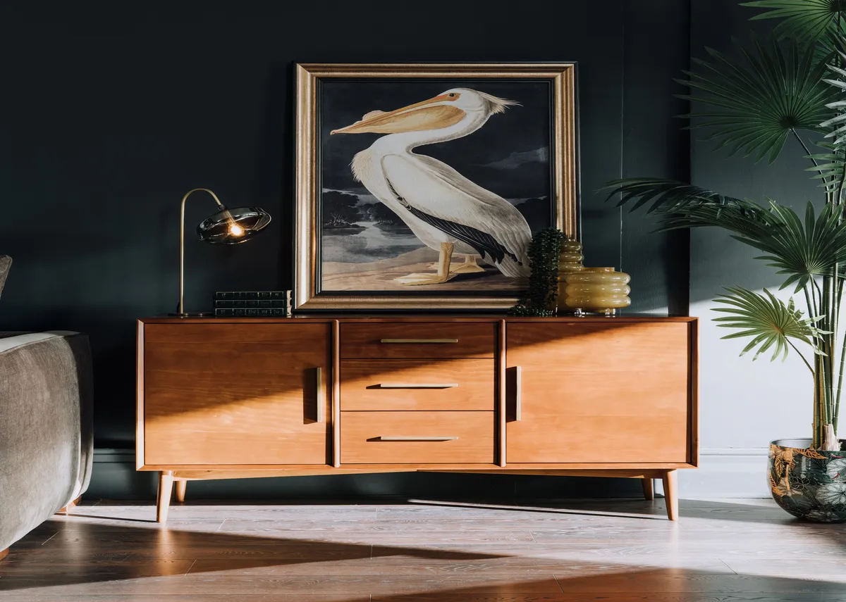 A lifestyle image of the Leya sideboard with the Pelican picture and Camila table lamp.