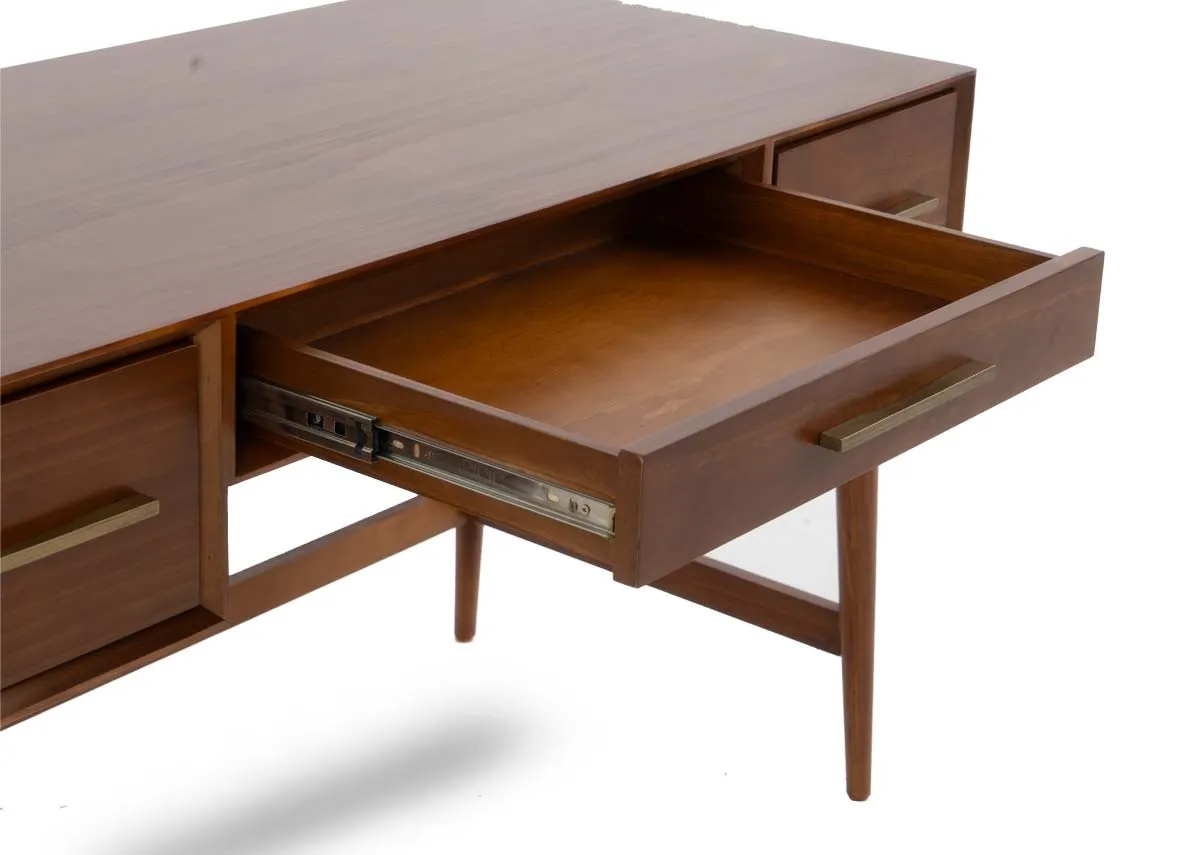 A close up view of an open drawer on the dark pine console table revealing the interior storage space.