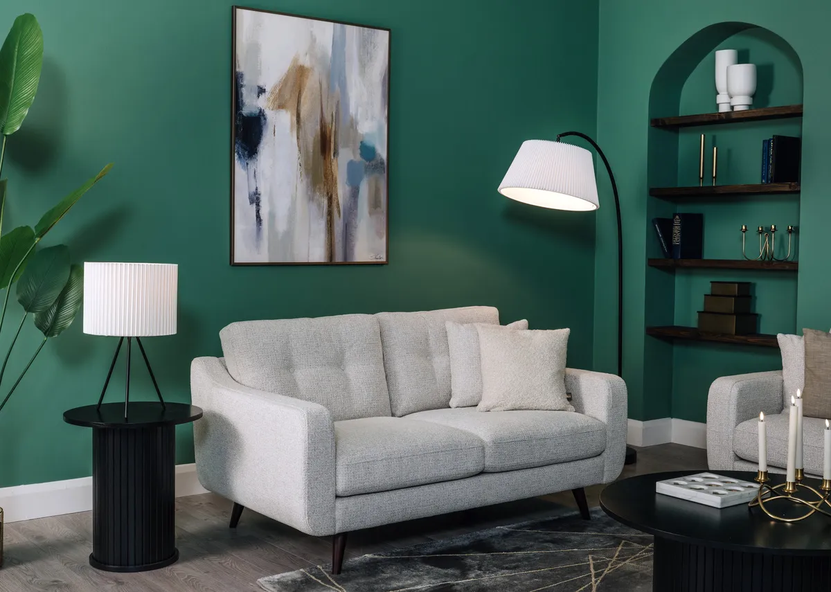 A lifestyle image of the Bandon light grey sofa with Nola side table with Inspire canvas.