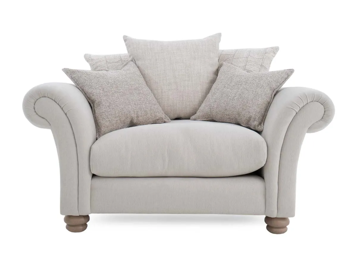 A cream pillowback cuddler from EZ Livings Paloma range.Front view of 3 large and 2 small cushions 