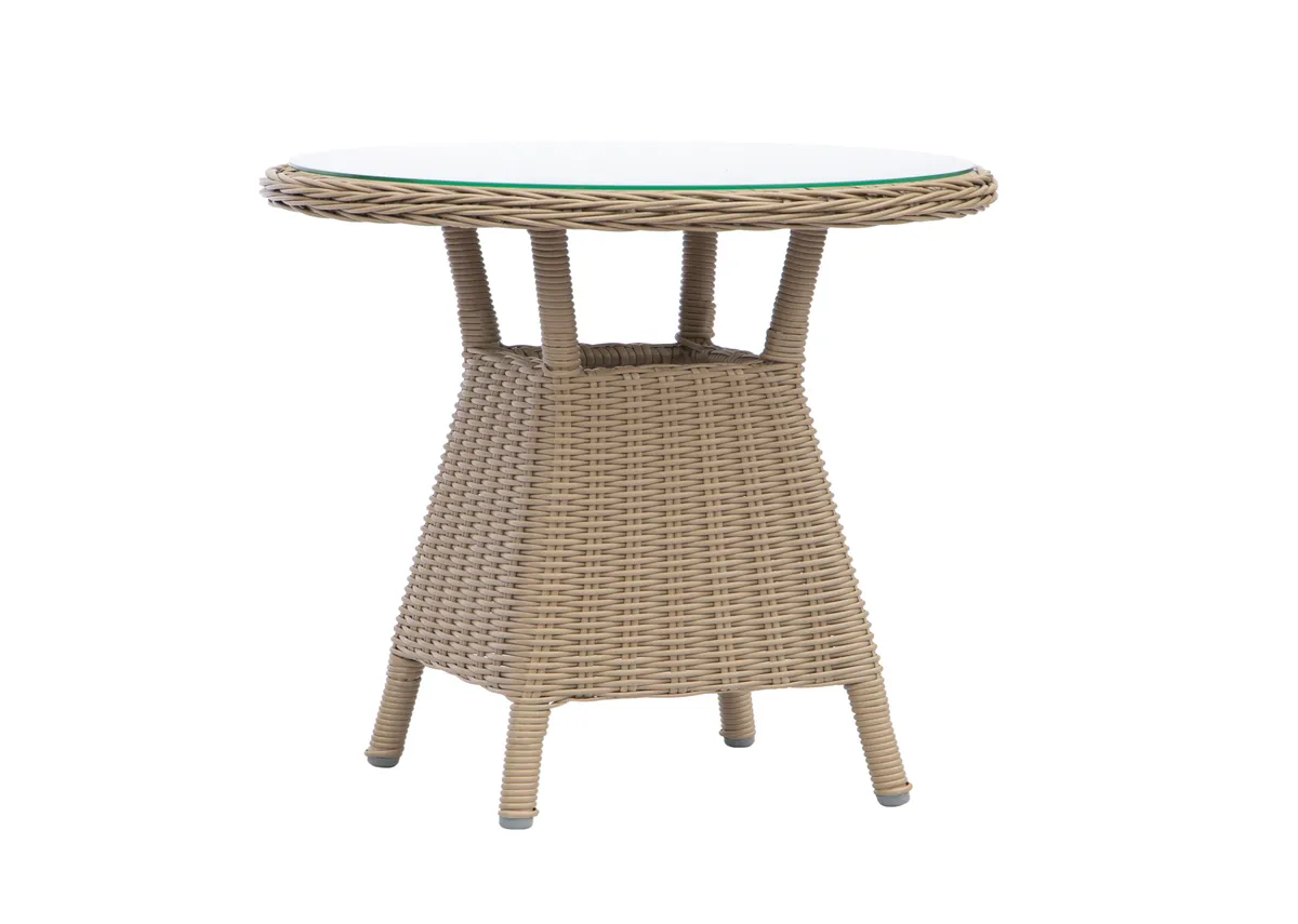 A small rattan balcony table from EZ Livings Seville range. Side view of glass table top.
