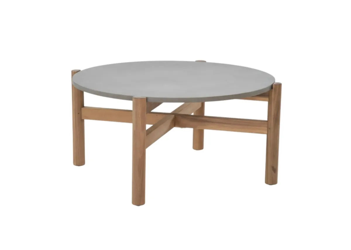A round garden coffee table with concrete top from EZ Livings La Palma range. Angled view.