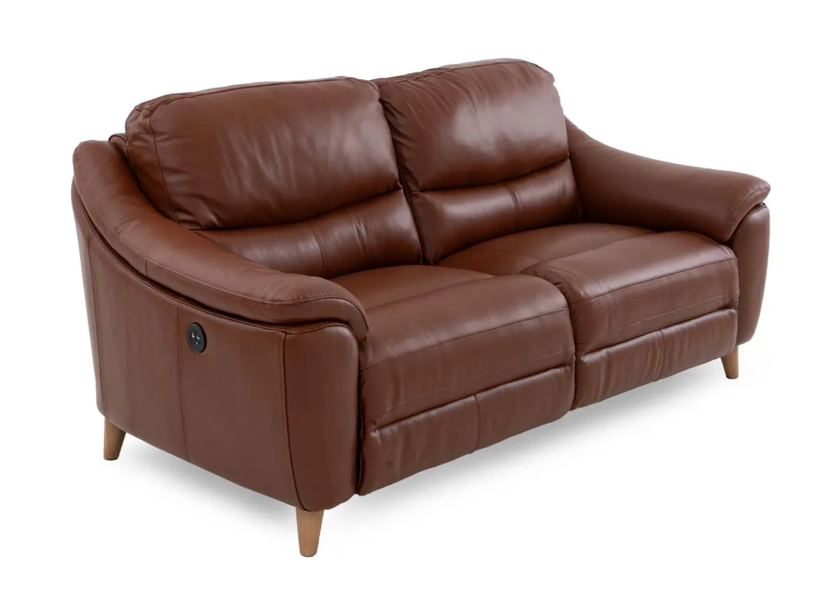 A brown leather 2 seater recliner sofa from EZ Livings Blaze range. Angled view of padded armrests and oak feet.